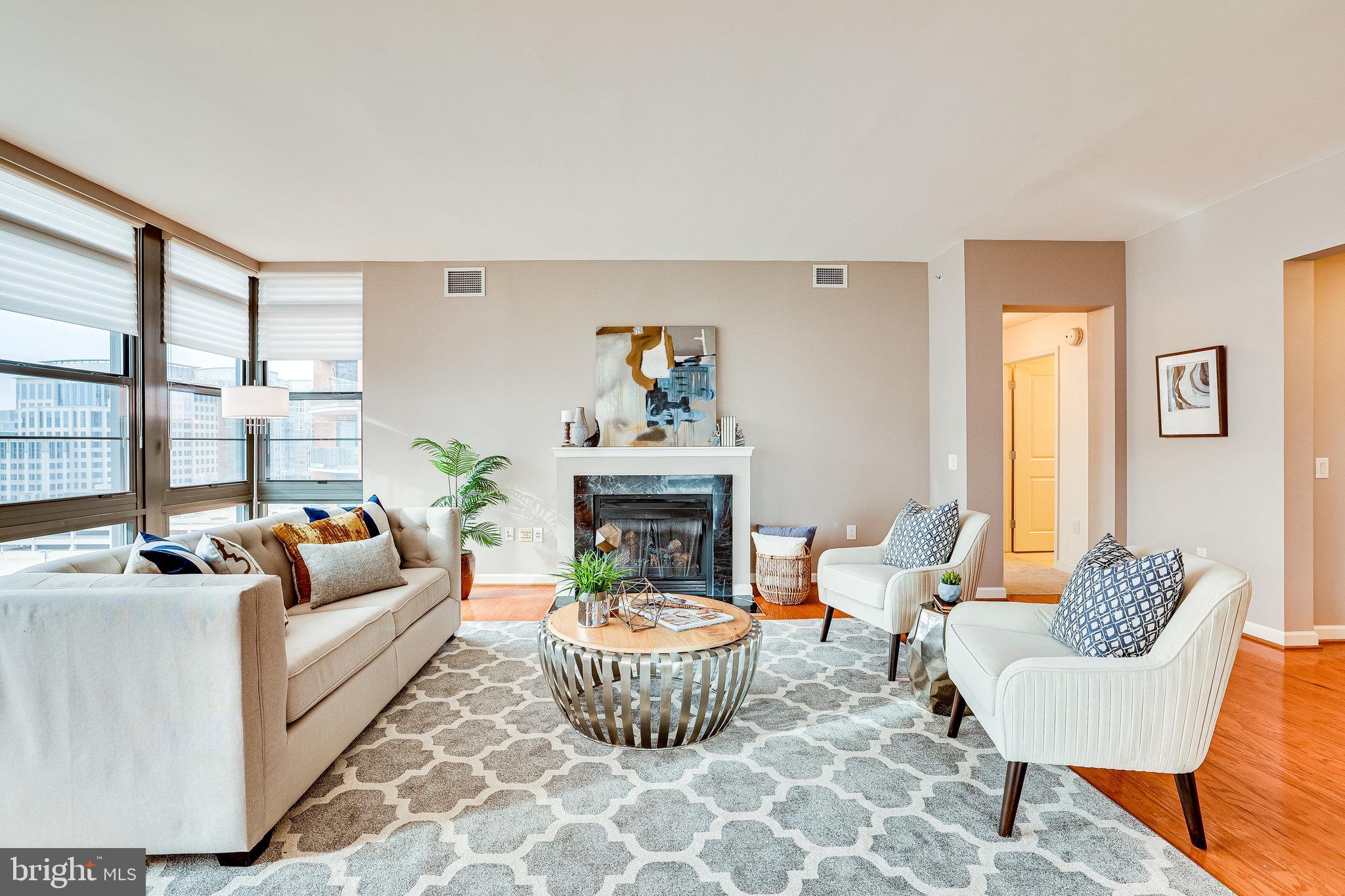 1830 Fountain Drive, Unit 1008 Reston, VA 20190 - Photo 8 of 42 Get comfortable around the gas fireplace.