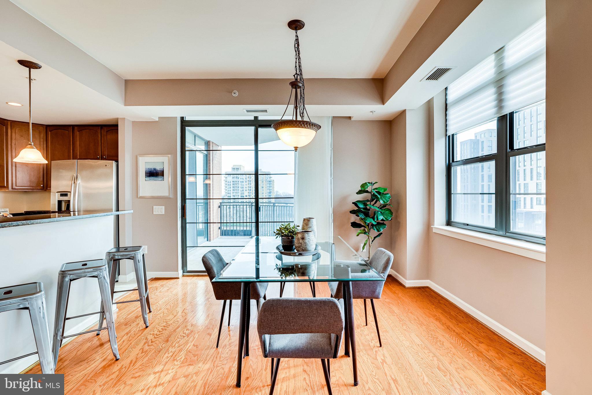 1830 Fountain Drive, Unit 1008 Reston, VA 20190 - Photo 10 of 42 Dining room has access out to the balcony.