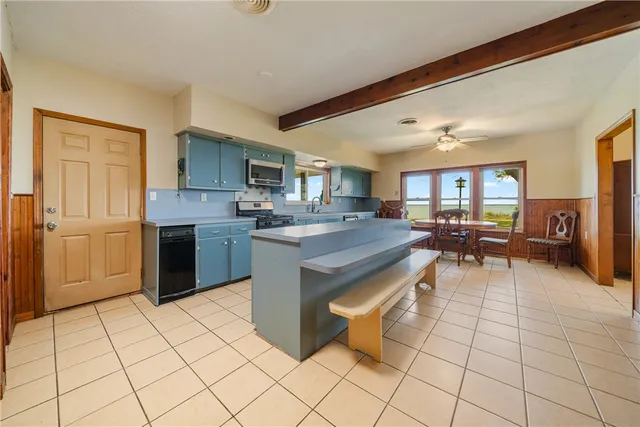 a bathroom with a bathtub and a sink