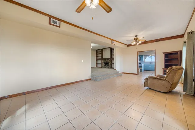 a view of an empty room with stairs