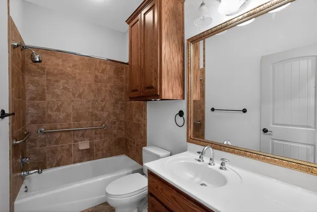 a bathroom with a sink a toilet and a bathtub