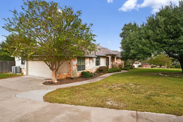 a front view of a house with swimming pool having outdoor seating