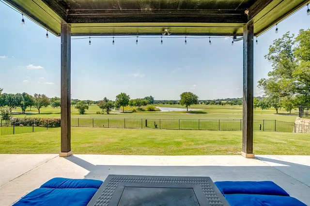 a view of a swimming pool and a yard