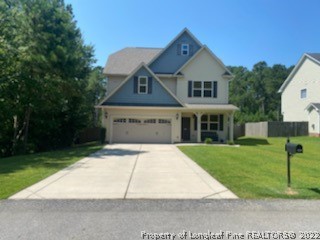 200 Pender Road Spring Lake, NC 28390 - Photo 2 of 9 a front view of a house with a yard
