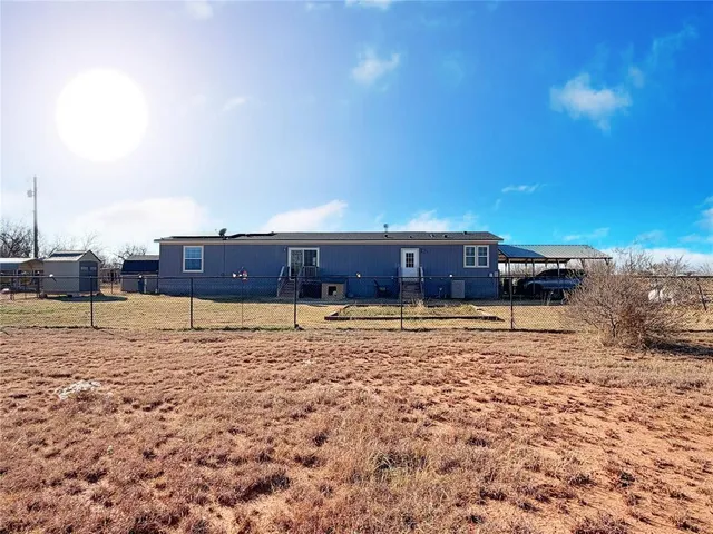 a house view with swimming pool