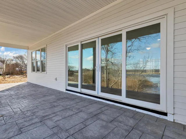 a view of an empty room with glass door
