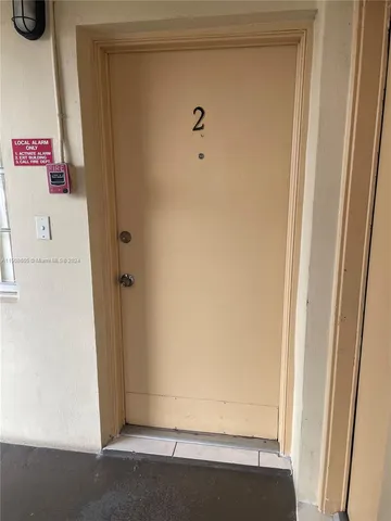 a view of a big room with staircase and windows