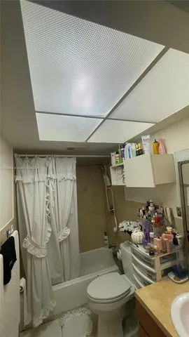 a bedroom with a bed and dresser