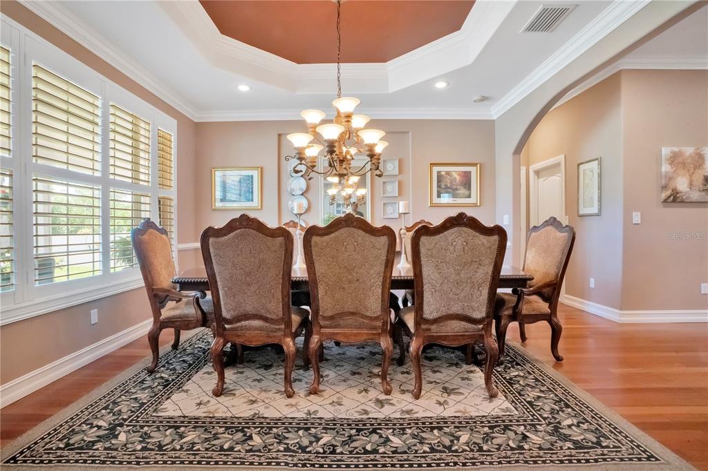 5785 Gilliam Road Orlando, FL 32818 - Photo 15 of 100 a view of a dining room with furniture window and wooden floor