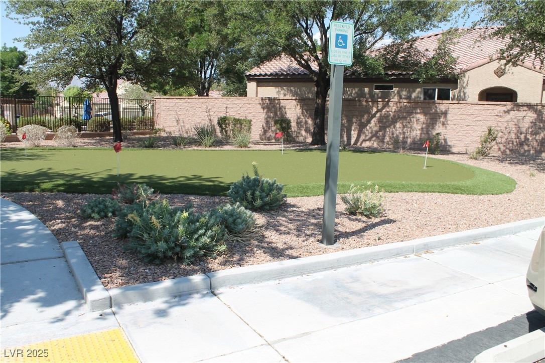 7352 Ravines Avenue Las Vegas, NV 89131 - Photo 18 of 93 View of property's community featuring an area to practice putting