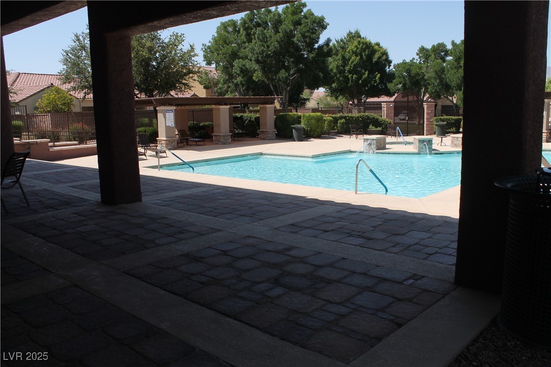 7352 Ravines Avenue Las Vegas, NV 89131 - Photo 23 of 93 Community pool with a patio area