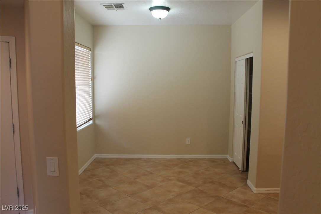 7352 Ravines Avenue Las Vegas, NV 89131 - Photo 45 of 93 Unfurnished room featuring light tile patterned flooring
