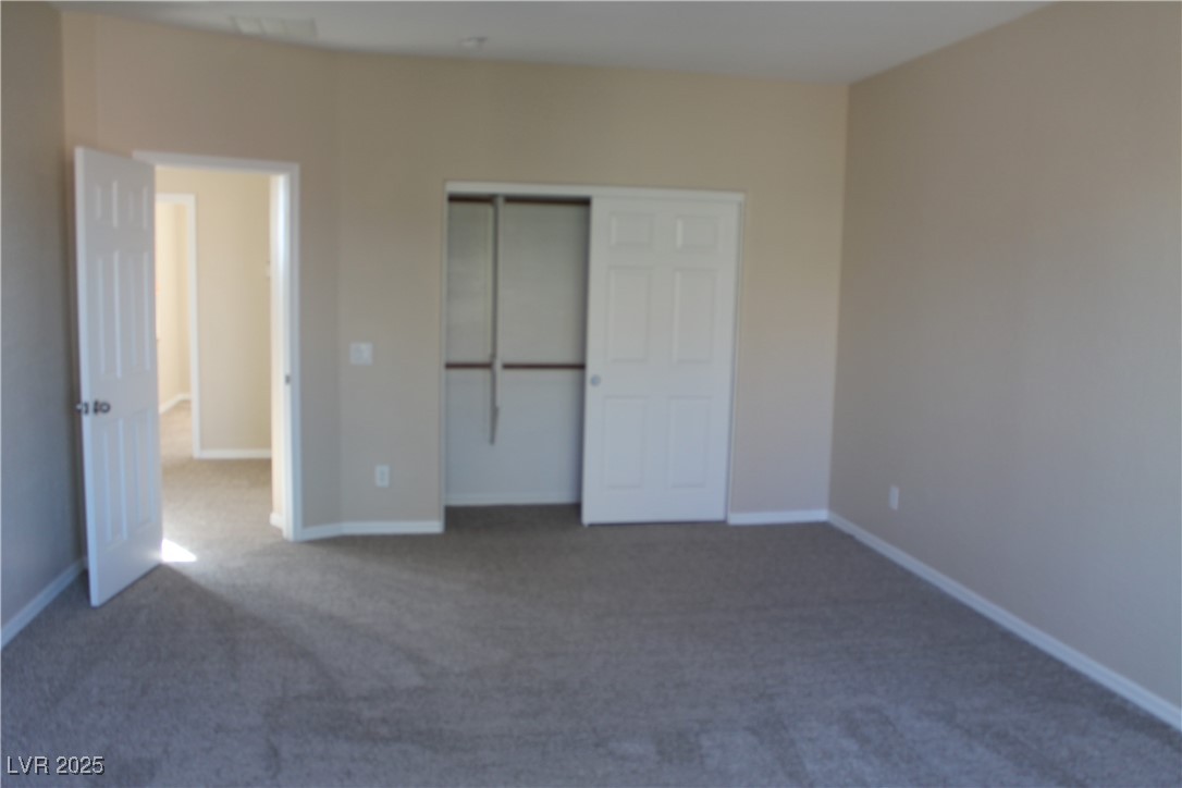 7352 Ravines Avenue Las Vegas, NV 89131 - Photo 67 of 93 Unfurnished bedroom featuring carpet floors and a closet