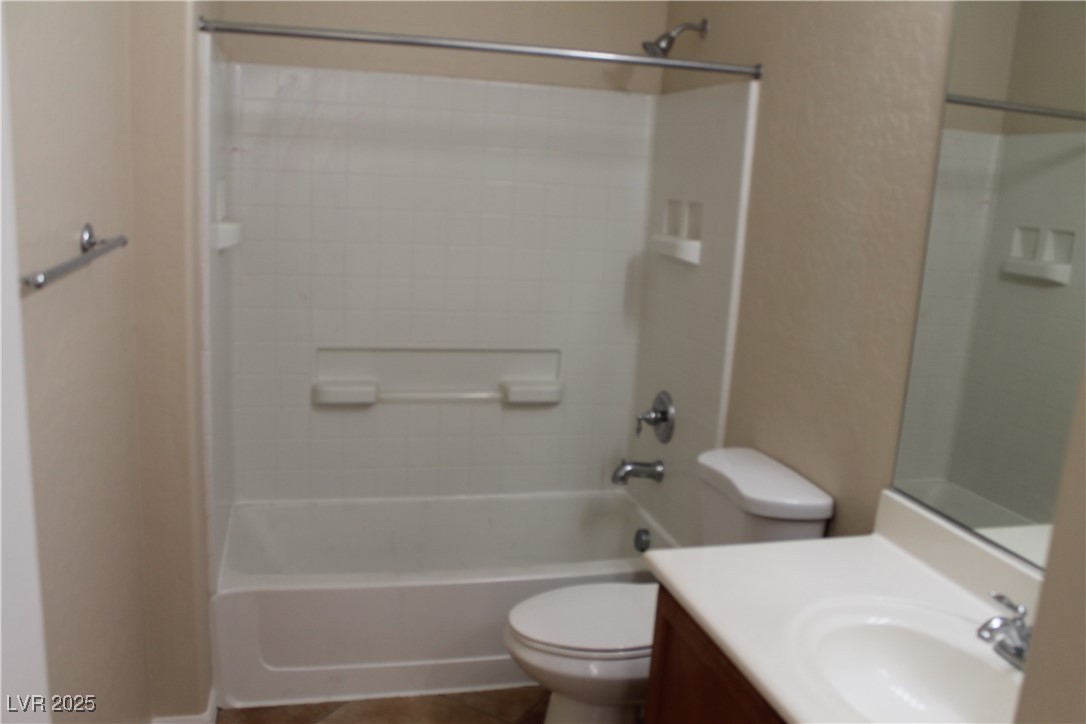 7352 Ravines Avenue Las Vegas, NV 89131 - Photo 69 of 93 Bathroom featuring shower / bathtub combination, vanity, and tile patterned floors