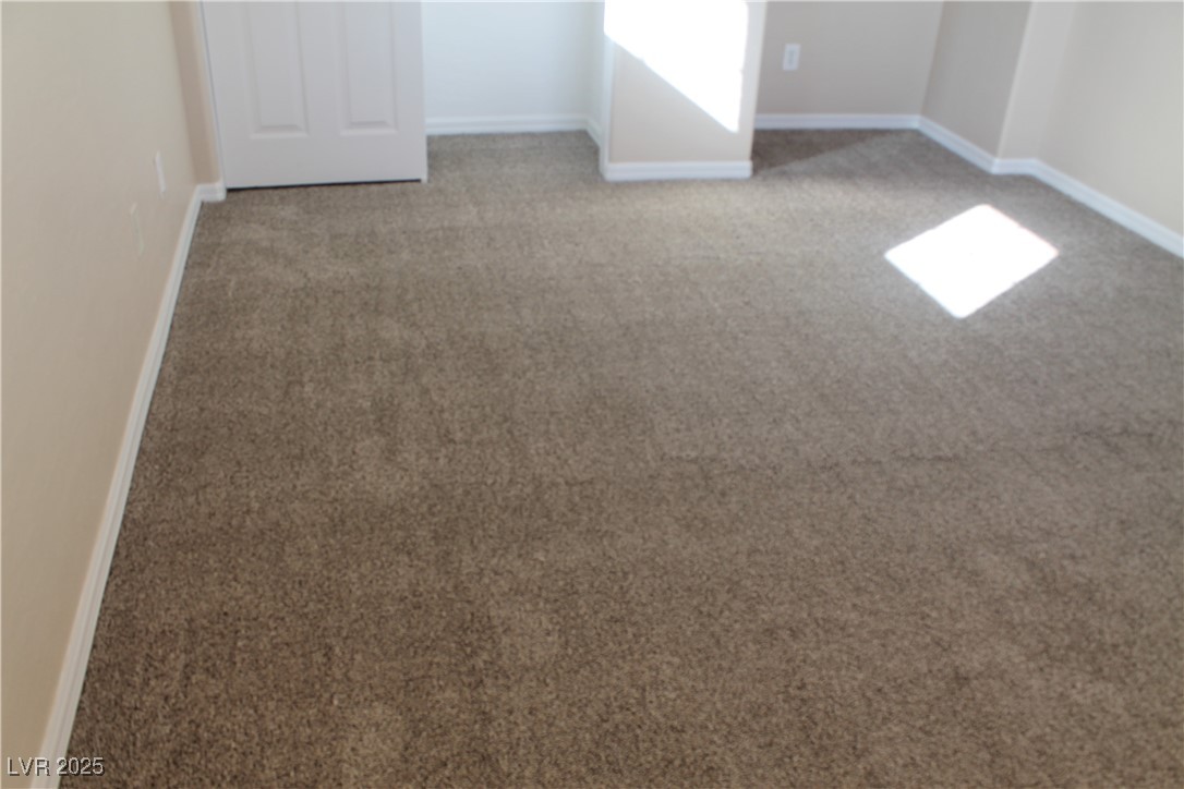 7352 Ravines Avenue Las Vegas, NV 89131 - Photo 70 of 93 Detailed view of carpet floors and baseboards