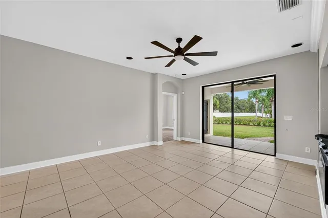 a white toilet sitting next to a bath tub