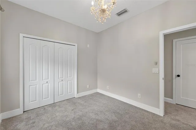 a view of a backyard with table and chairs