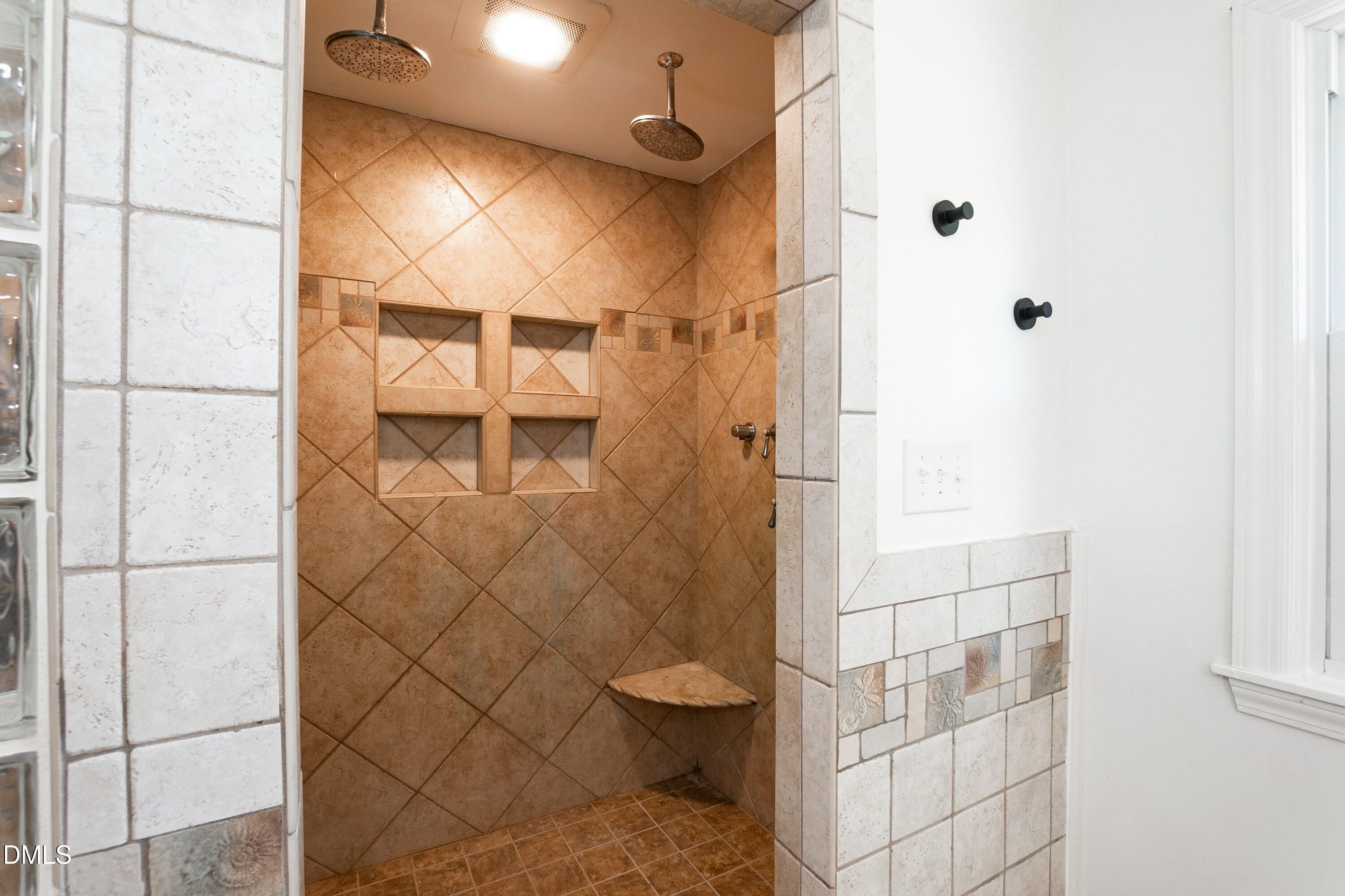 641 Rocky Ford Road Louisburg, NC 27549 - Photo 18 of 38 a bathroom with a toilet and a shower