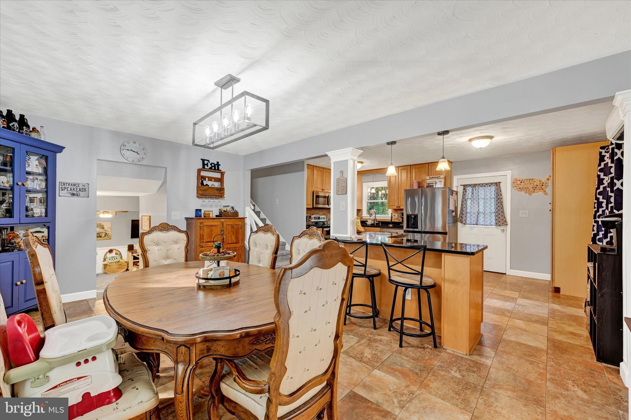 20 Houcksville Road South Hampstead, MD 21074 - Photo 12 of 37 a view of a dining room with furniture and a chandelier