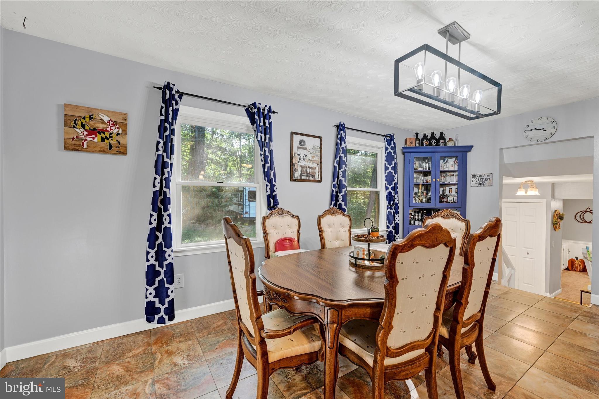 20 Houcksville Road South Hampstead, MD 21074 - Photo 14 of 37 a dining room with furniture and a chandelier