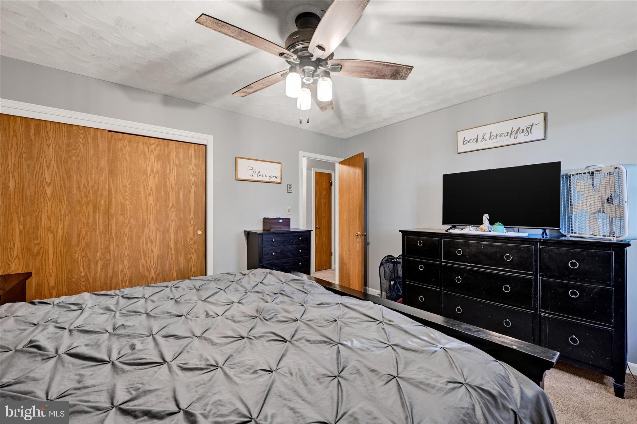 20 Houcksville Road South Hampstead, MD 21074 - Photo 20 of 37 a bedroom with a bed and a flat screen tv