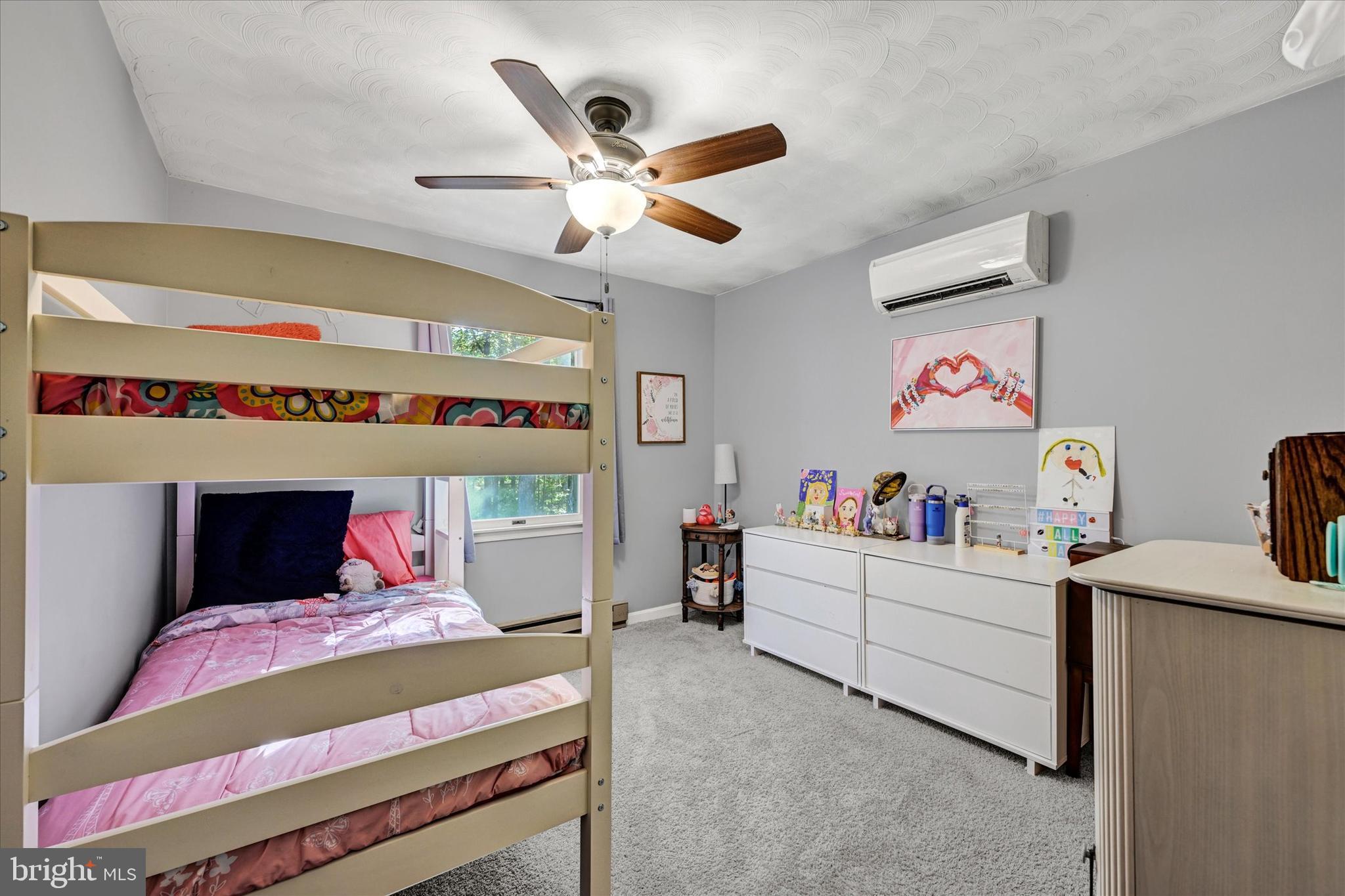 20 Houcksville Road South Hampstead, MD 21074 - Photo 21 of 37 a bedroom with a bed and a chandelier