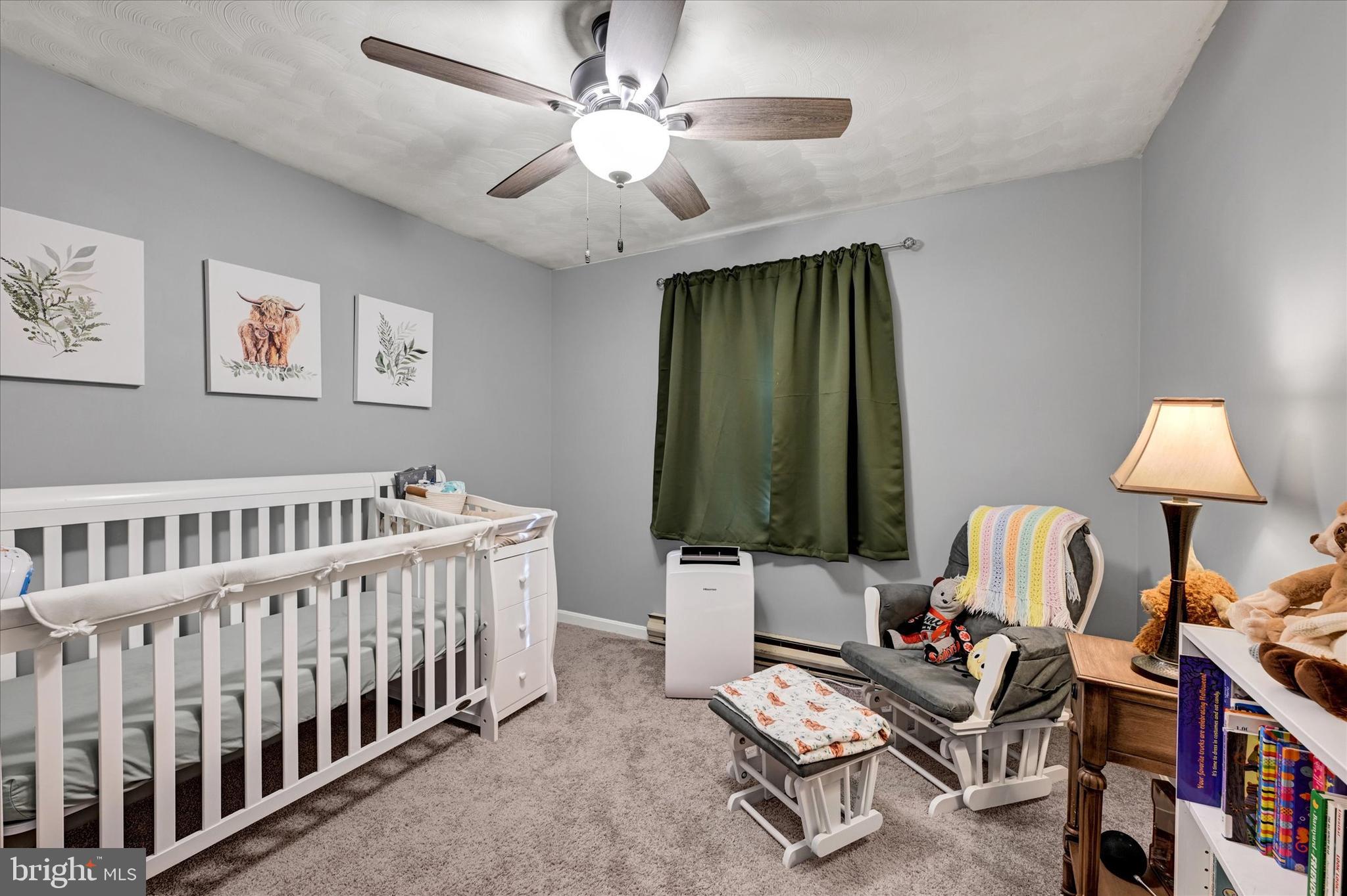 20 Houcksville Road South Hampstead, MD 21074 - Photo 22 of 37 a bedroom with furniture and a chandelier fan