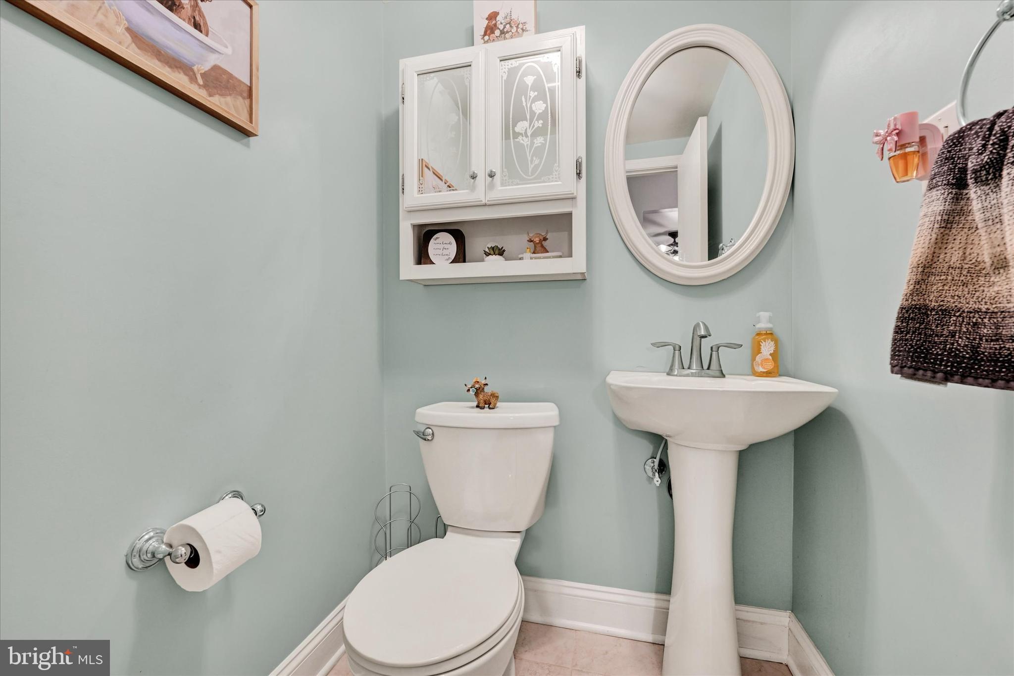 20 Houcksville Road South Hampstead, MD 21074 - Photo 24 of 37 a bathroom with a sink mirror and toilet