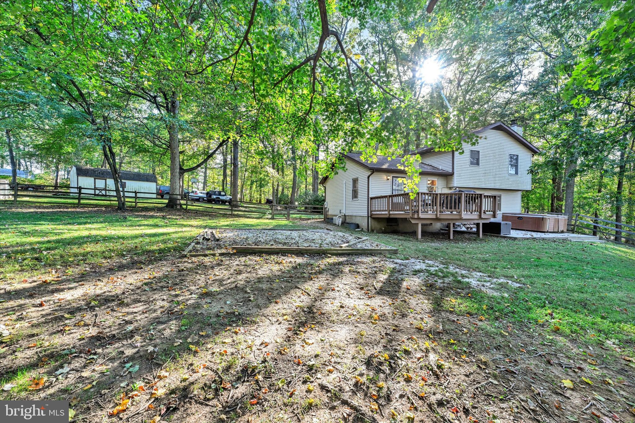 20 Houcksville Road South Hampstead, MD 21074 - Photo 35 of 37 a front view of a house with a garden and trees