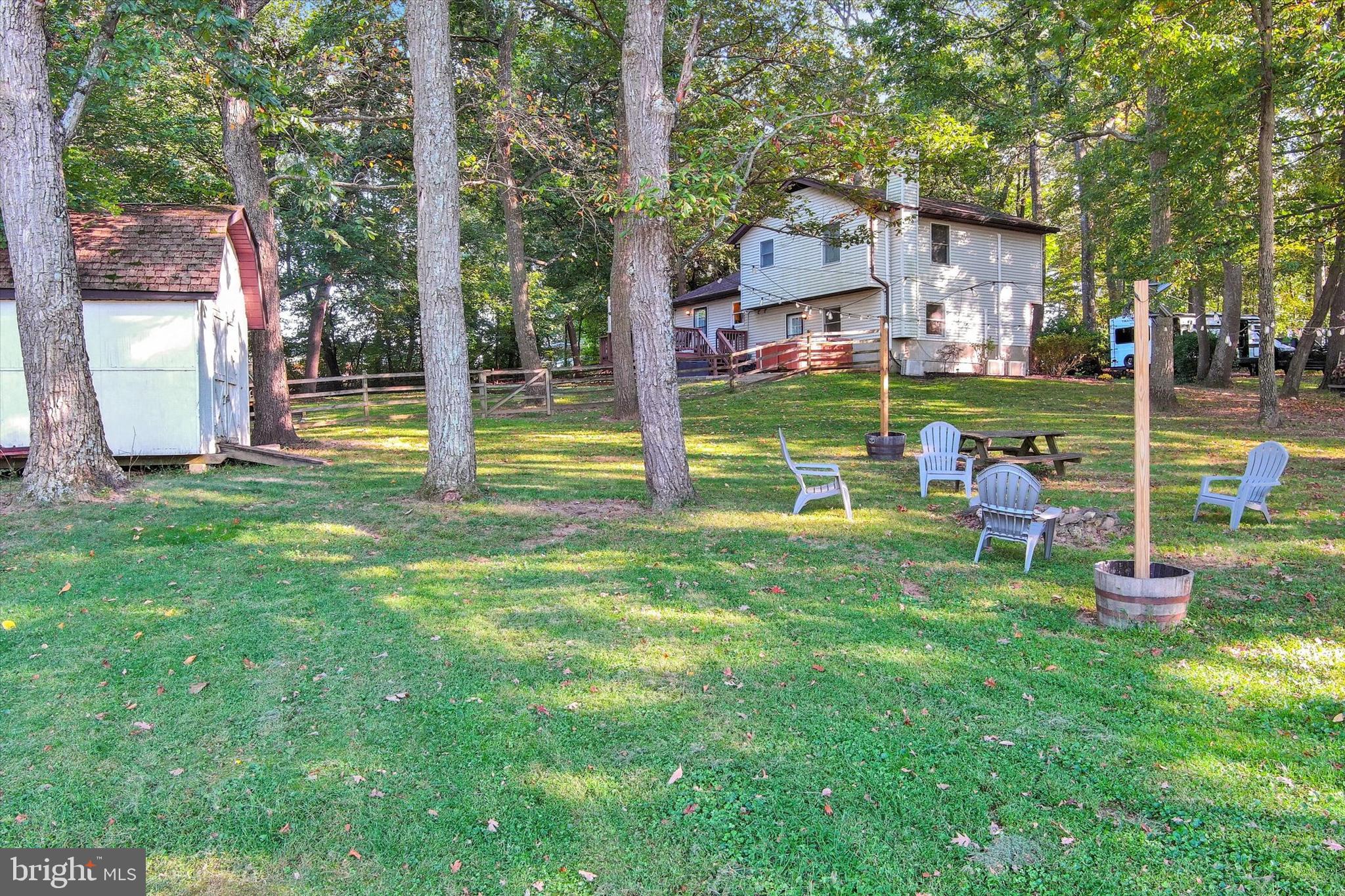 20 Houcksville Road South Hampstead, MD 21074 - Photo 4 of 37 a view of a house with a yard table and chairs