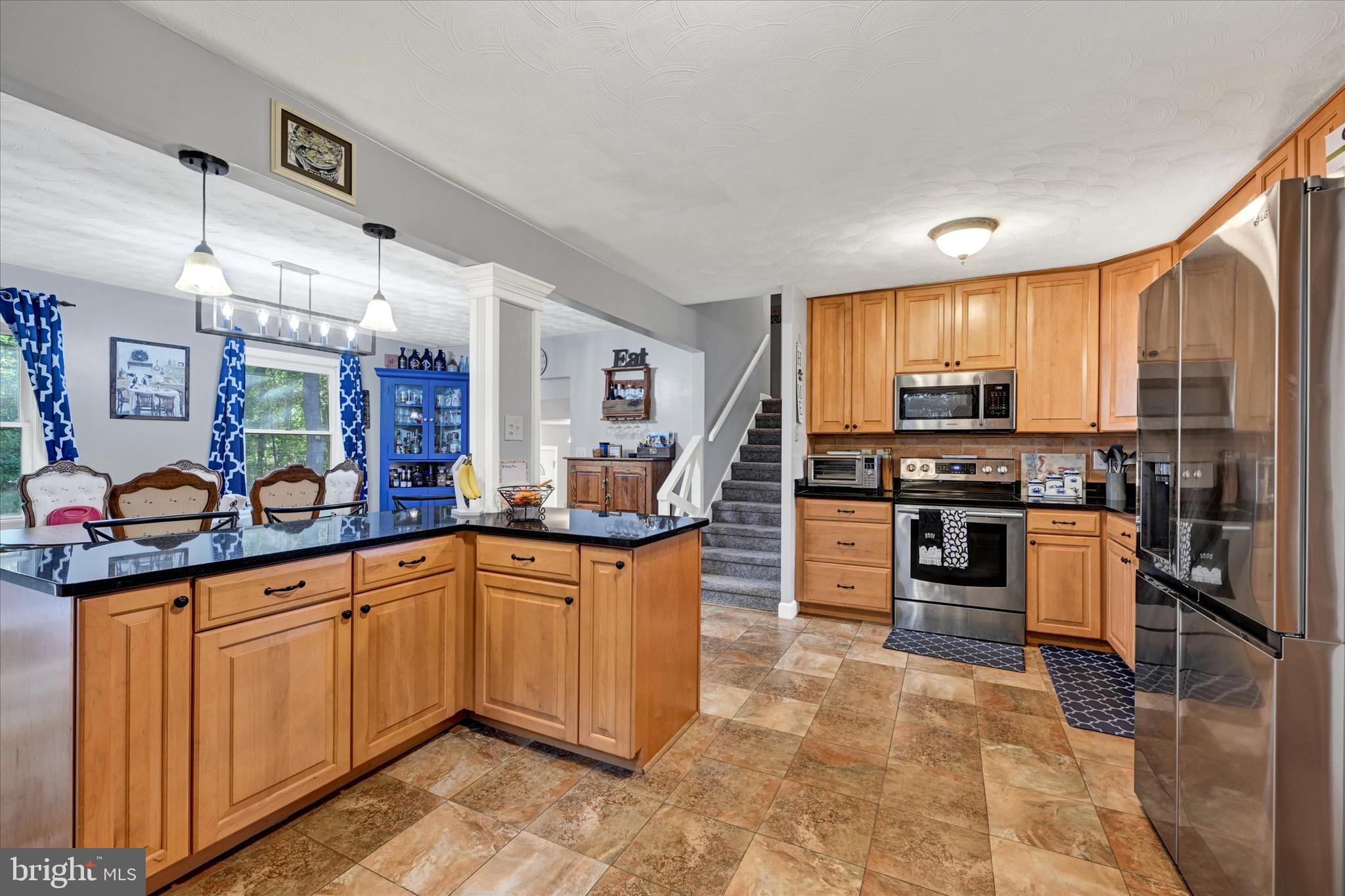 20 Houcksville Road South Hampstead, MD 21074 - Photo 6 of 37 a kitchen with stainless steel appliances a stove sink and cabinets