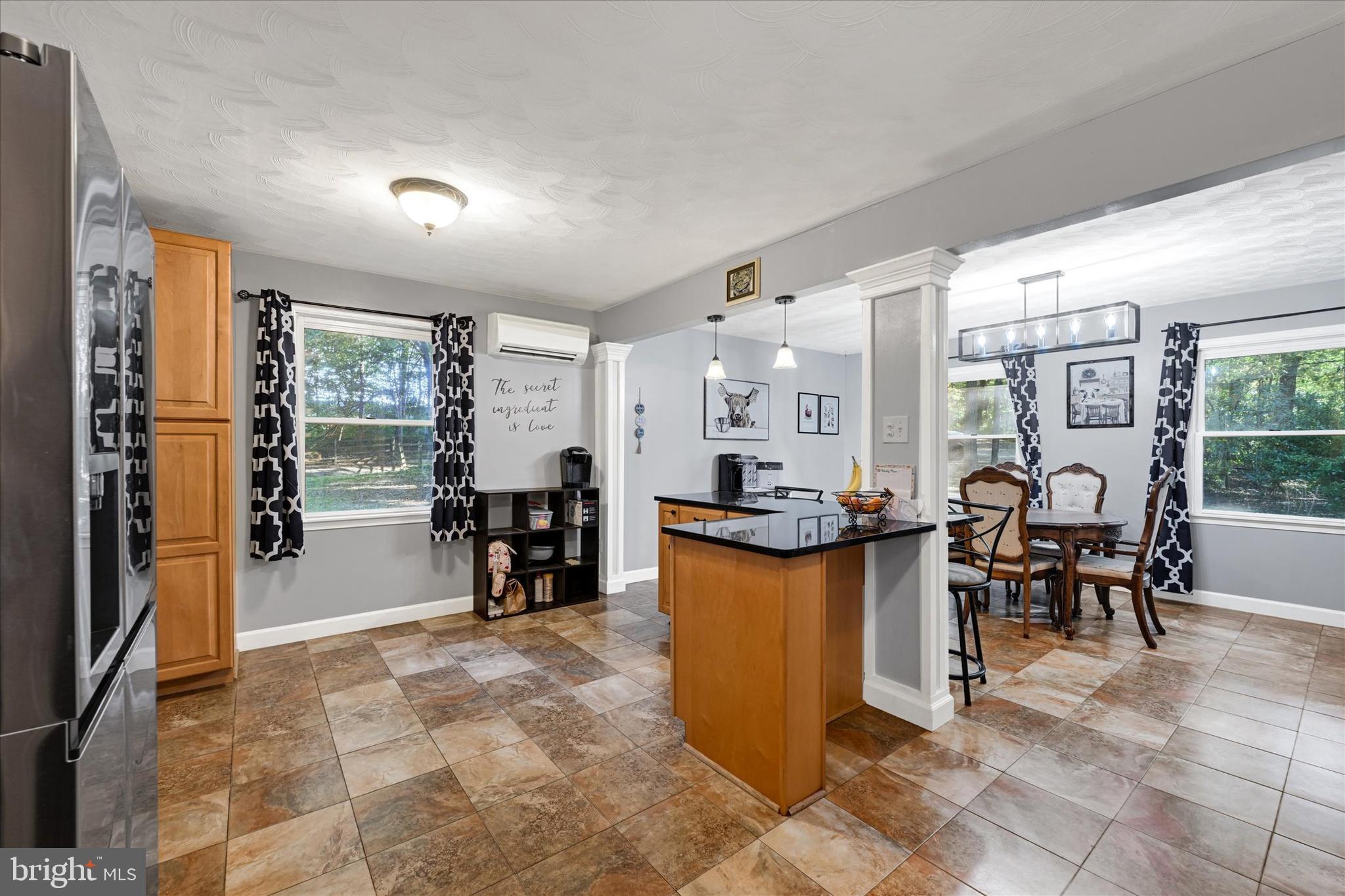 20 Houcksville Road South Hampstead, MD 21074 - Photo 9 of 37 a dining hall with stainless steel appliances granite countertop a couch a table and chairs in it
