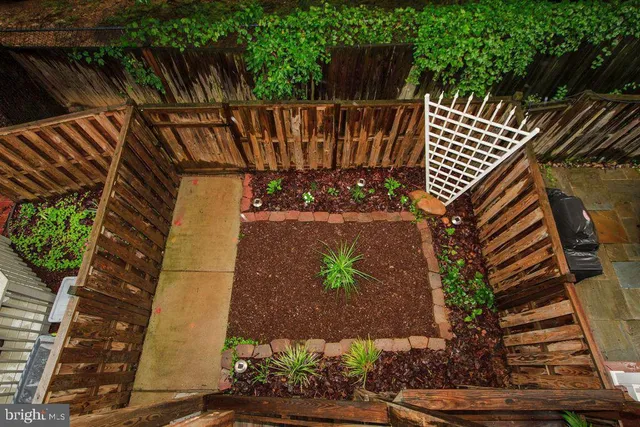 a view of street along with wooden fence