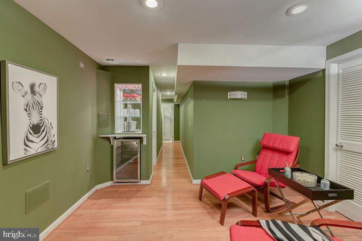 1618 South Taylor Street Arlington, VA 22204 - Photo 16 of 22 a hallway with furniture and wooden floor