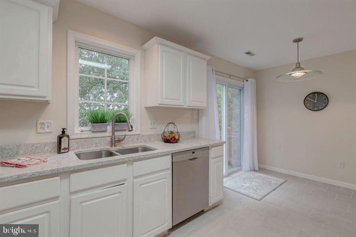 1618 South Taylor Street Arlington, VA 22204 - Photo 4 of 22 a kitchen with a sink cabinets and window