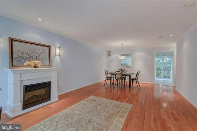 a living room with furniture a table and a fireplace