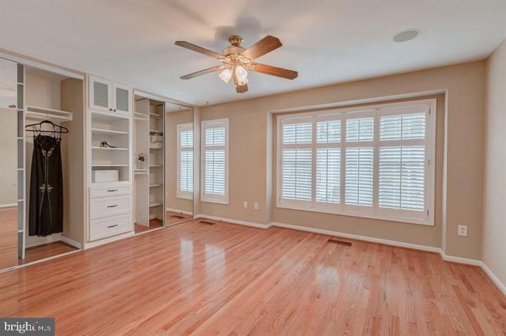 1618 South Taylor Street Arlington, VA 22204 - Photo 9 of 22 a view of an empty room with a window and wooden floor