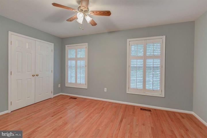 1618 South Taylor Street Arlington, VA 22204 - Photo 10 of 22 a view of an empty room with wooden floor and a window