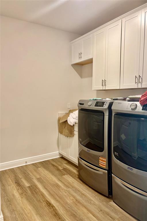 4307 Pullet Court Lakewood Ranch, FL 34211 - Photo 13 of 16 a kitchen with a stove and a white cabinets