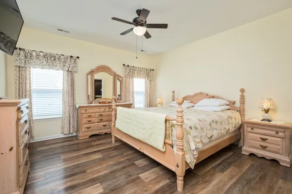 a bed room with a bed and a chandelier