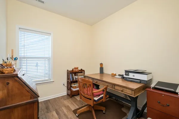 a room with a desk and a workspace