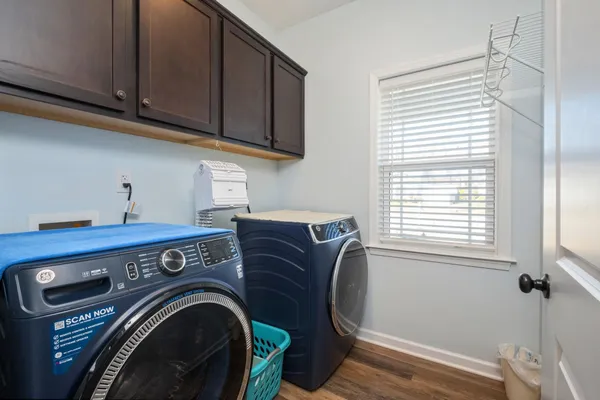 a view of cabinets and washer dryer