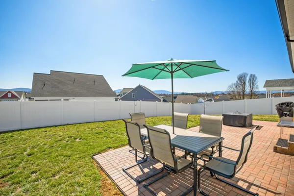 an outdoor space with furniture and umbrella