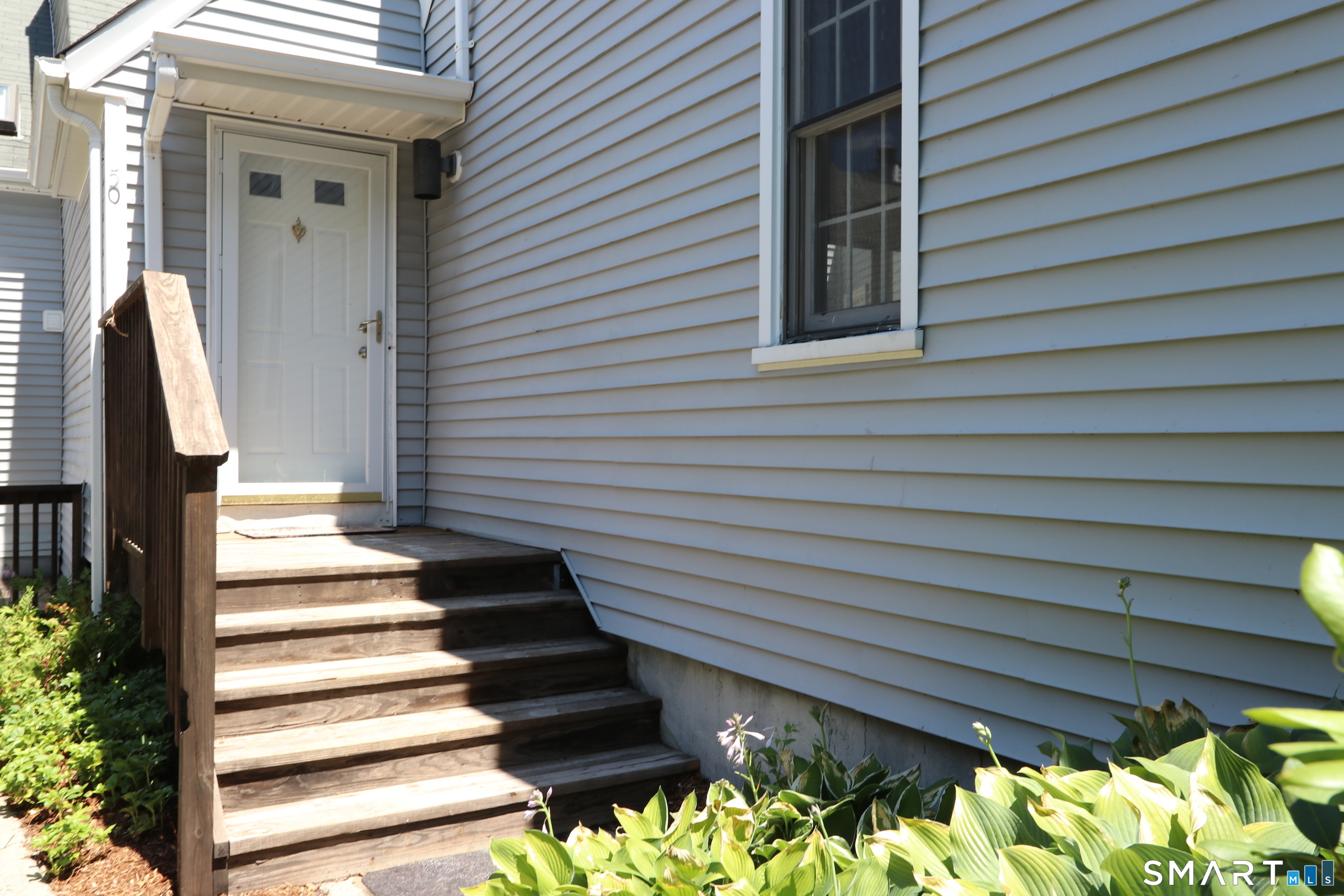 50 Wilton Crest Road, Unit 50 Wilton, CT 06897 - Photo 27 of 31 Steps up from the walkway to unit number 50