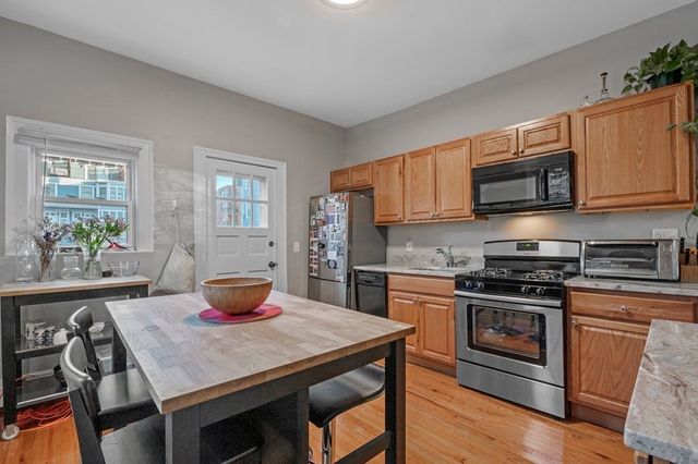 wooden floor with closet and mirror