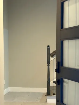 a view of staircase with white walls