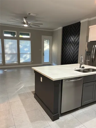a bathroom with a sink vanity and a mirror