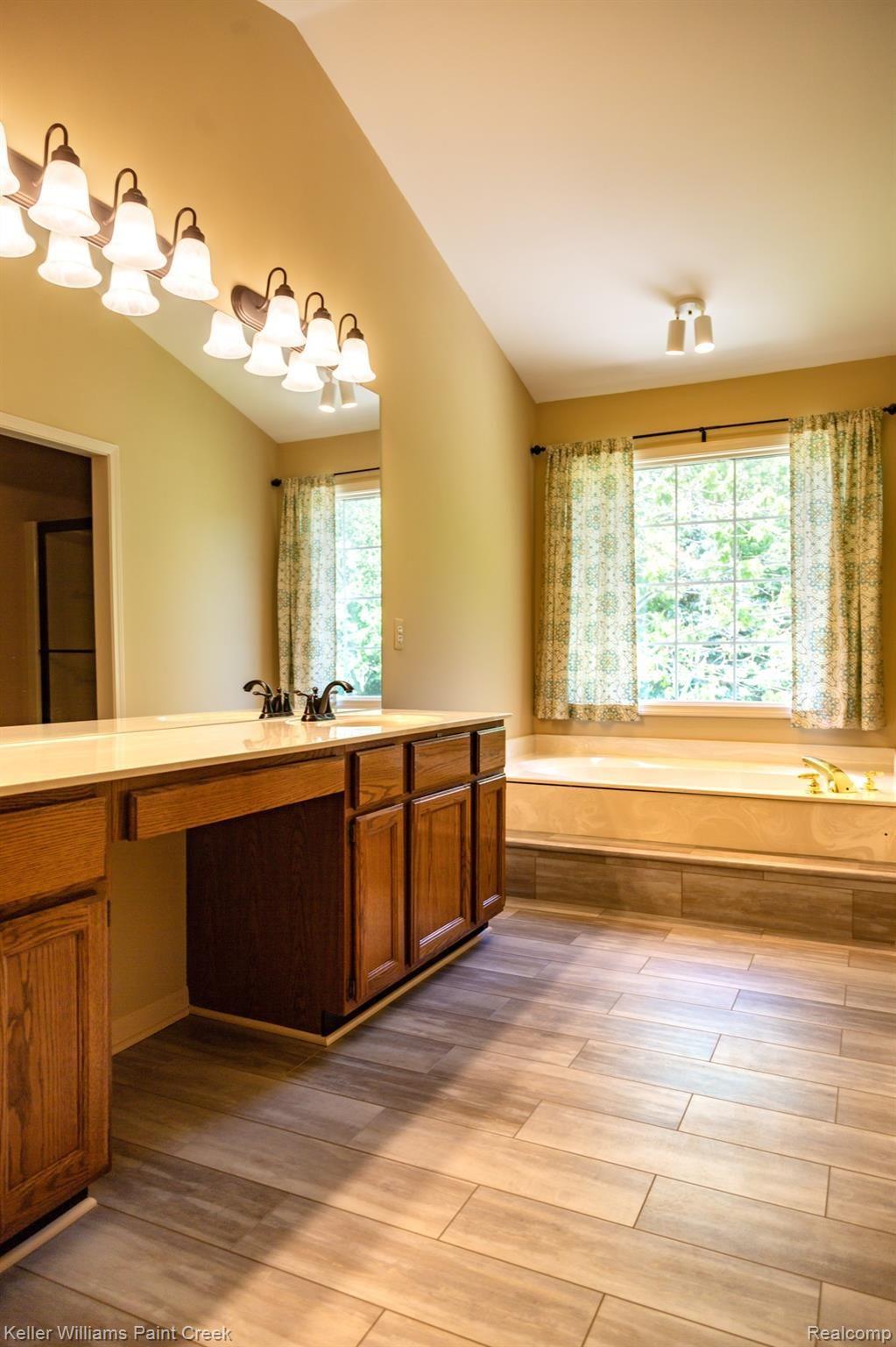 2452 Pleasant View Drive Rochester, MI 48306 - Photo 10 of 52 Beautiful master bath w/luxurious garden tub, privacy toilet & shower room!