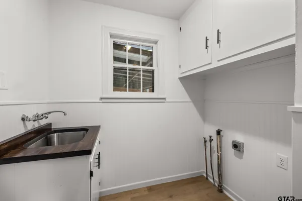a bathroom with a sink and vanity