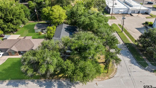 an aerial view of house with yard
